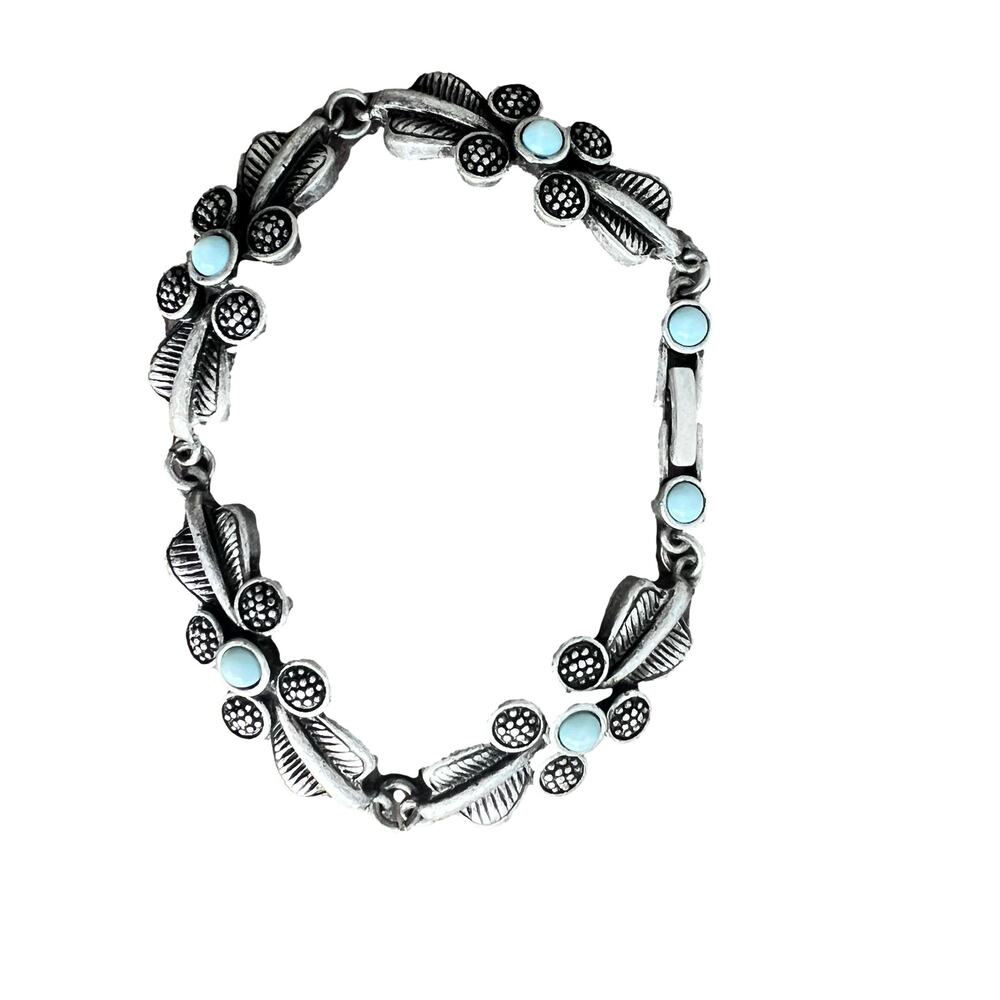 Silver and turquoise tone textured floral bracelet